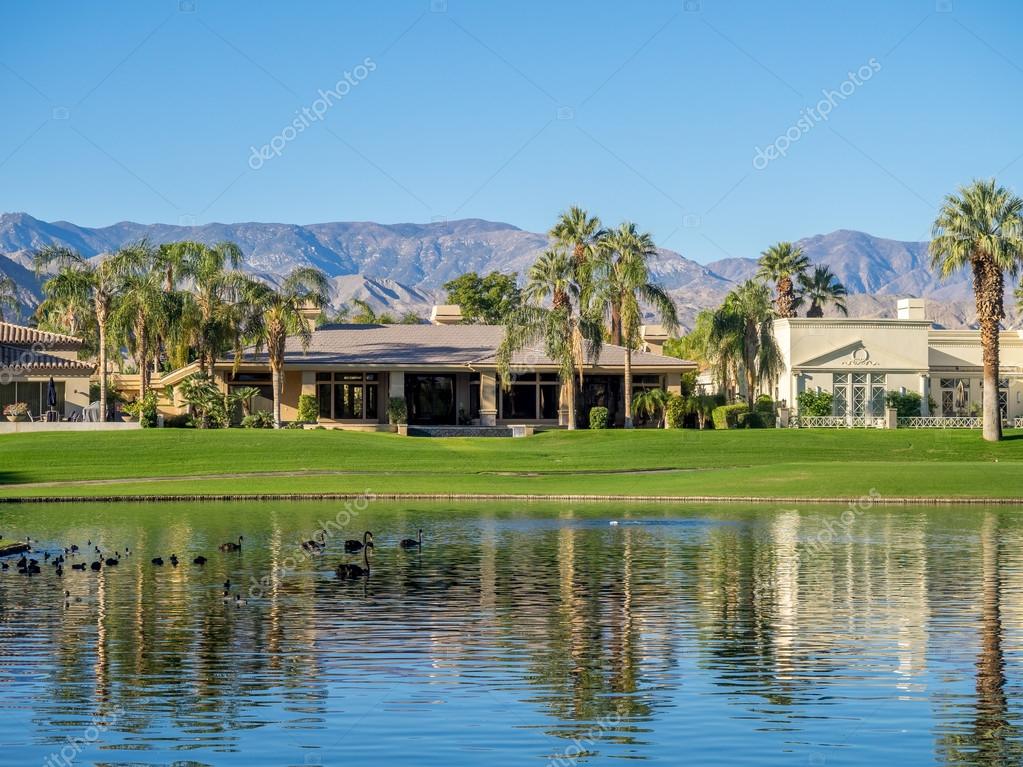 Luxury homes along a golf course in Palm Desert Stock Photo by ©jewhyte