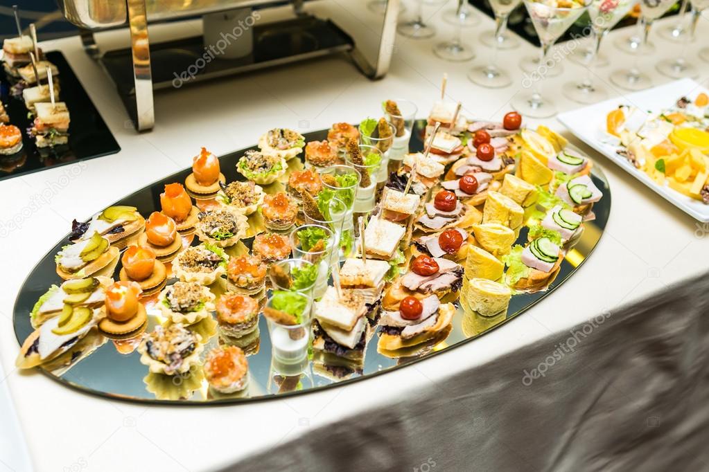 Beautifully decorated catering banquet table with different food