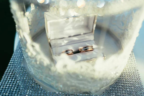 wedding rings in white wedding box on ceremony place