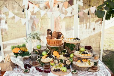 rustic bagging candy bar set up on wedding ceremony place clipart