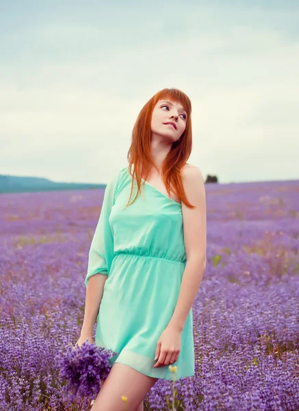 Portrait of young beautiful girl in a field — Stock Photo, Image