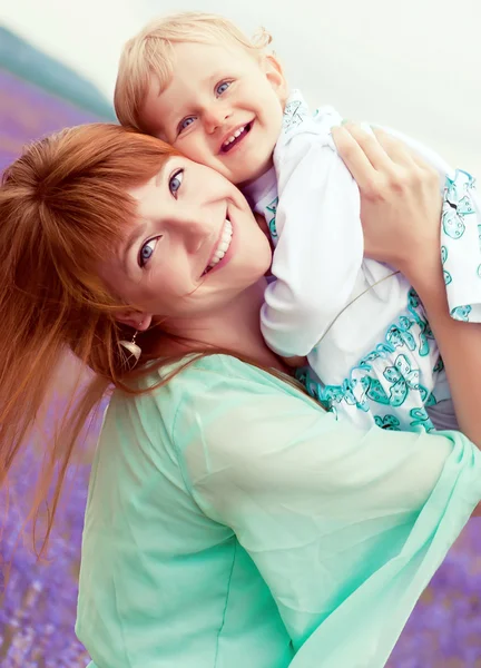 Beautiful mother and baby having fun in nature — Stock Photo, Image