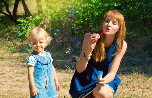 Young mother and baby in the park — Stock Photo, Image