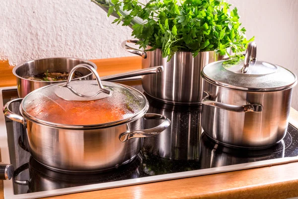Cooking pots on the stove — Stock Photo, Image