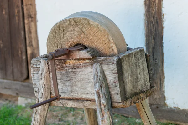 Old grindstone at village — Stock Photo, Image