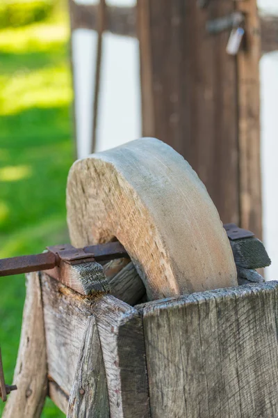 Old grindstone at village — Stock Photo, Image