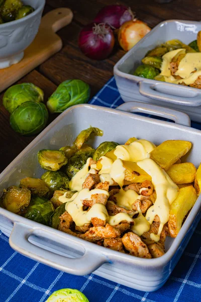 Gratinated Zurich ragout with Brussels sprouts, potatoes and Bearnaise sauce