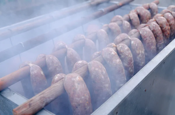 Smoking oven with meats — Stock Photo, Image