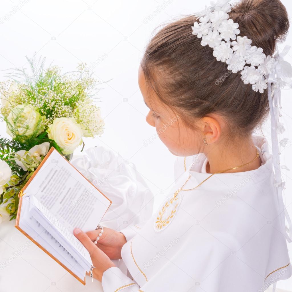 Girl reading First Holy Communion