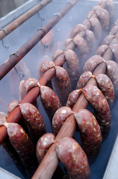 Smoking oven with meats — Stock Photo, Image