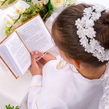 Girl reading First Holy Communion clipart