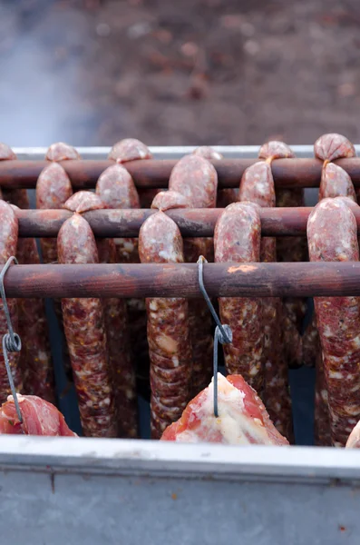 Smoking oven with meats — Stock Photo, Image