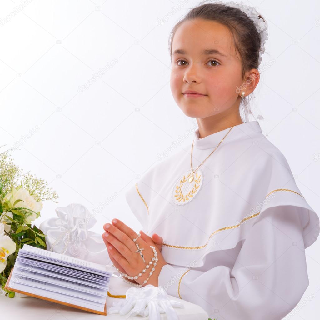 Girl reading First Holy Communion