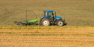 Hay rake on the field
