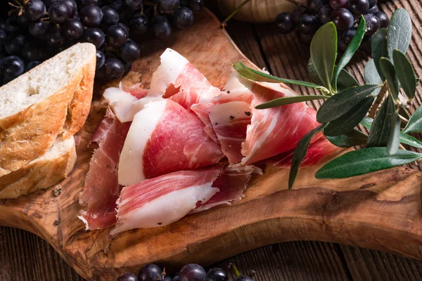 Wine, grape and prosciutto — Stock Photo, Image