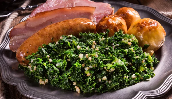 Grilled meat with kale — Stock Image Grilled meat with kale Stock Photo