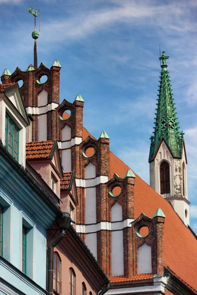 Green Rooster on the roof of the old church in Riga — Stock Photo, Image