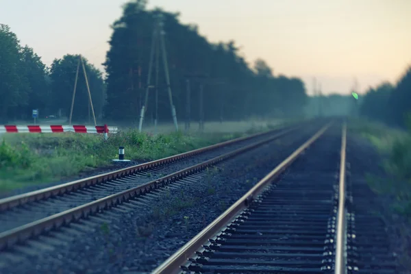 Railway in autumn mist. Blurry