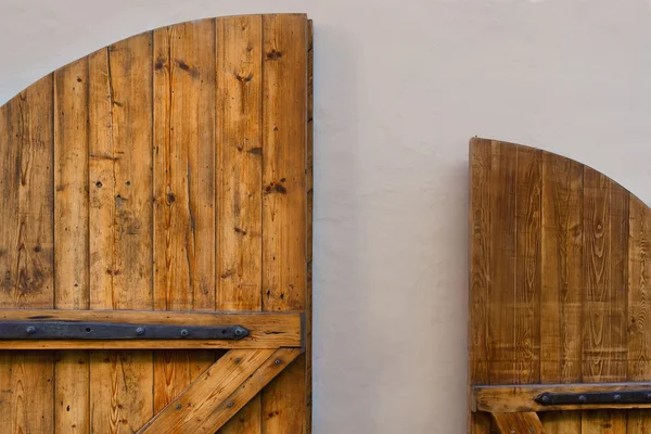 Yellow wooden door against a white wall — Stock Photo, Image