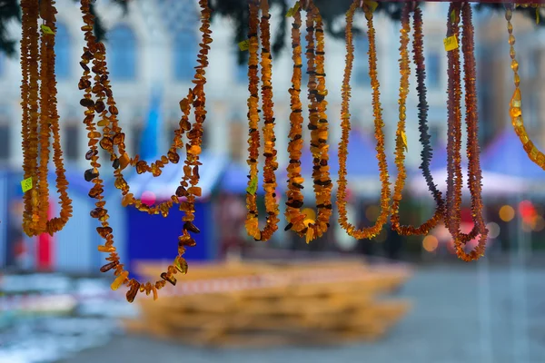 Amber beads on the Christmas Fair at New Year — Stock Photo, Image