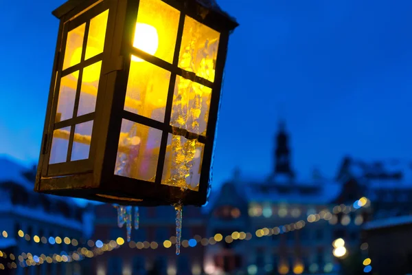 Yellow light on the background of the old town and blue sky — Stock Photo, Image