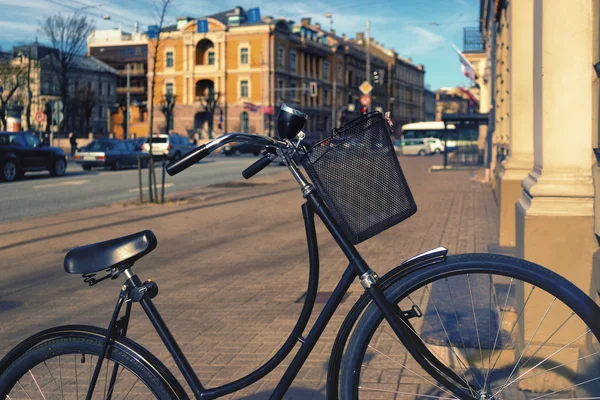 Bicycle stands on the streets of the city in the spring — Stock Photo, Image