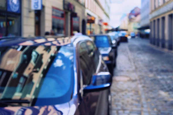 Reflection of the sky and the windows of the houses in the cars — Stock Photo, Image