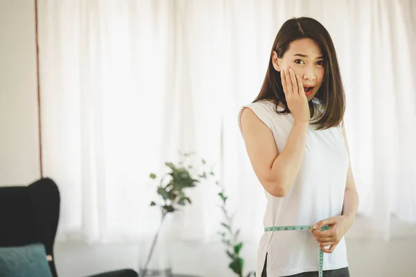 Asian Woman Using Measuring Tape Her Waist Looking Camera Shock — Stock Fotó