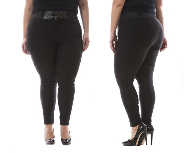 Модель плюс розмір одягають XXL чорні жіночі класичні штани зі шкіряним поясом і високими підборами ізольовані на білому тлі — стокове фото