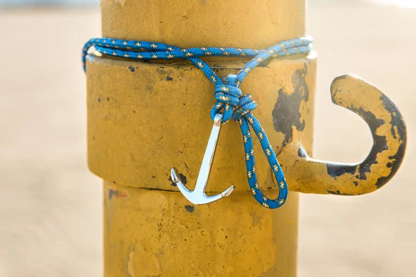 Colorful silver anchor wristband with blue rope — Stock Photo, Image