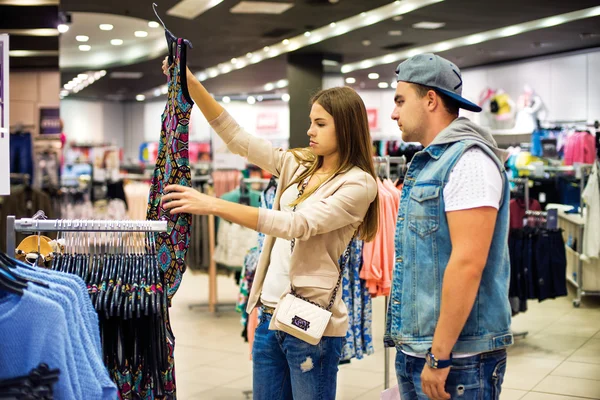 Portrait of shopping couple that choosing dress together — Stock Photo, Image