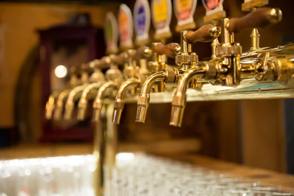 Different beer taps in the bar — Stock Photo, Image