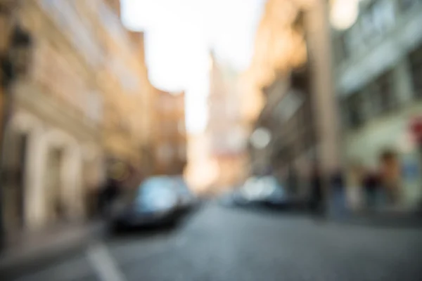 Suddig city road bakgrund med bilar och butiker — Stockfoto