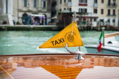 Taxi boat on Canal Grande with Venezia clipart