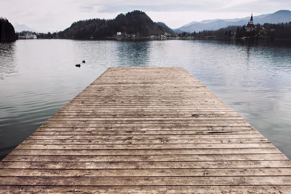 Wooden pier at the lake water — Stock Photo, Image