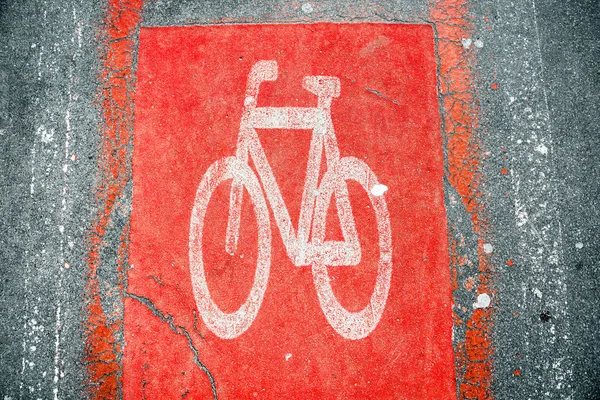 Red Bicycle road sign on the asphalt — Stock Photo, Image