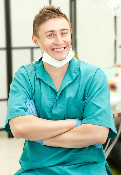 Young happy doctor in the clinic — Stock Photo, Image