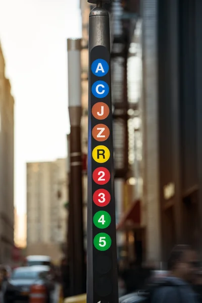 New York City metro line sign with A, C, J, Z, R, 2, 3, 4, 5 train — Stock Photo, Image