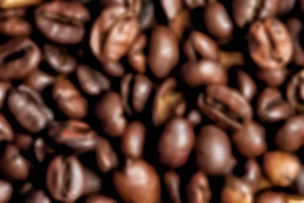 Abstract blurred background of roasted coffee beans — Stock Photo, Image