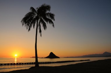 Chinamans Hat Sunrise at Kualoa Park, Oahu Hawaii clipart