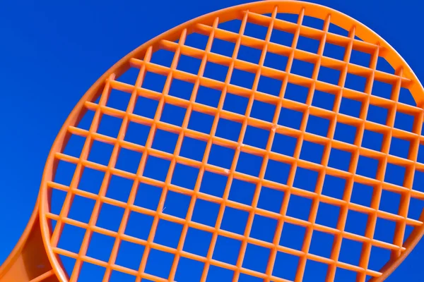 One orange racquet — Stock Photo, Image