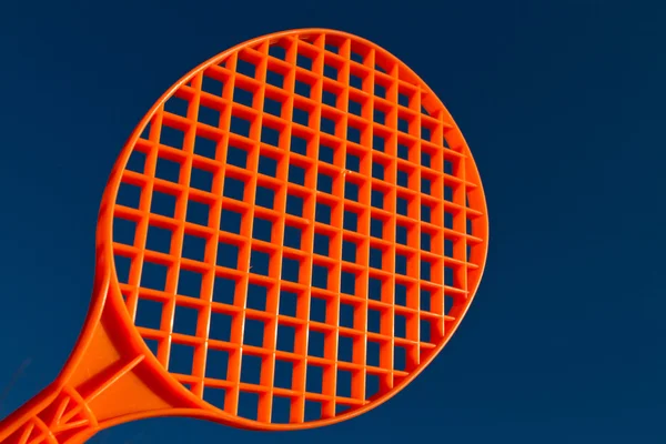 Una racchetta arancione — Foto Stock