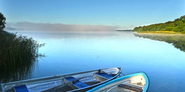 Lake with empty boats — Stock Photo, Image