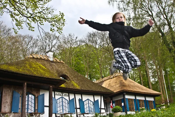 Girl jumping in the air — Stock Photo, Image