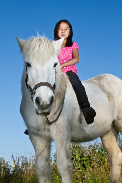 Girl ridding a white horse — Stock Photo, Image