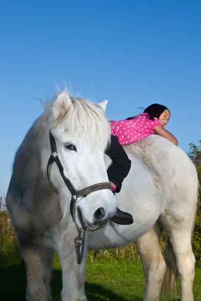 Girl ridding a white horse — Stock Photo, Image