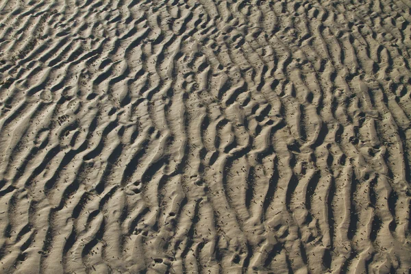 Zand patroon op het strand — Stockfoto