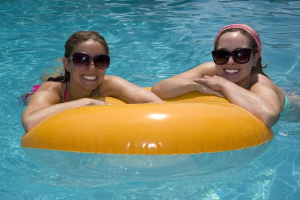 Girls in Pool Floating on Lifesaver — Stock Photo, Image