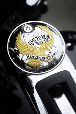 Close up of a motorcycle fuel tank cap with the Harley Davidson  clipart