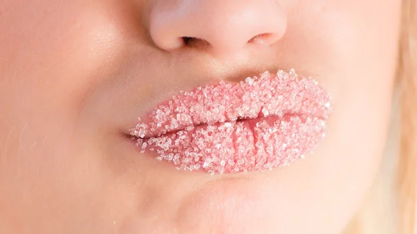 Closeup on young pretty woman with beautiful lips in sugar — Stock Photo, Image